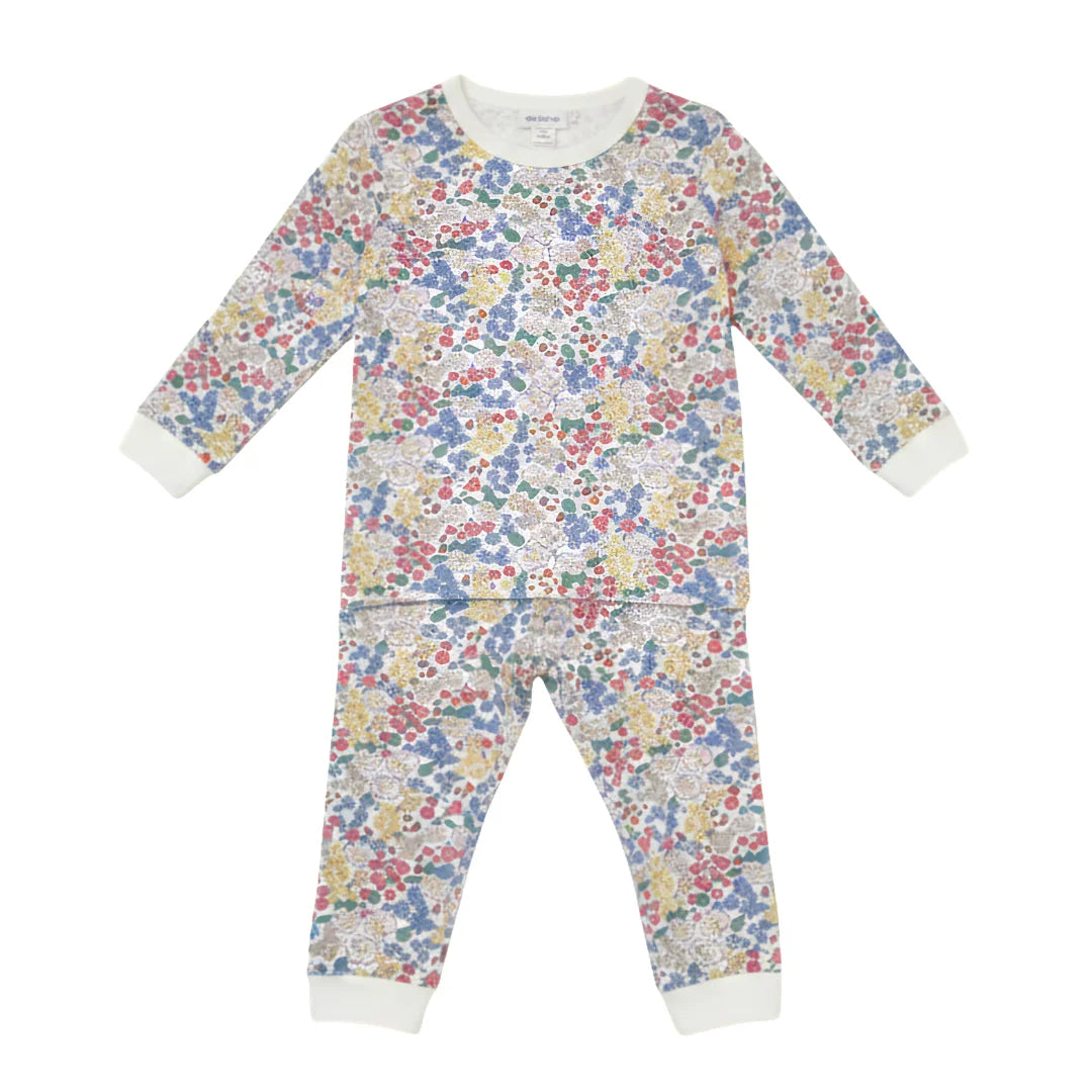 Floral patterned onesie on a white background