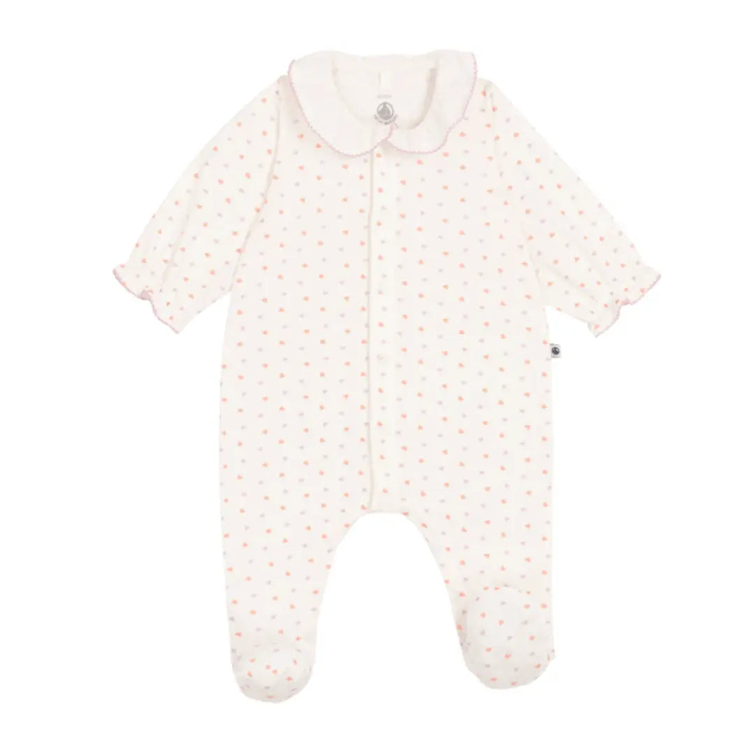 A breathtaking Petit Bateau collared footie featuring an immaculate white multi-heart print, seamless front snap closures, and a cozy footed silhouette.
