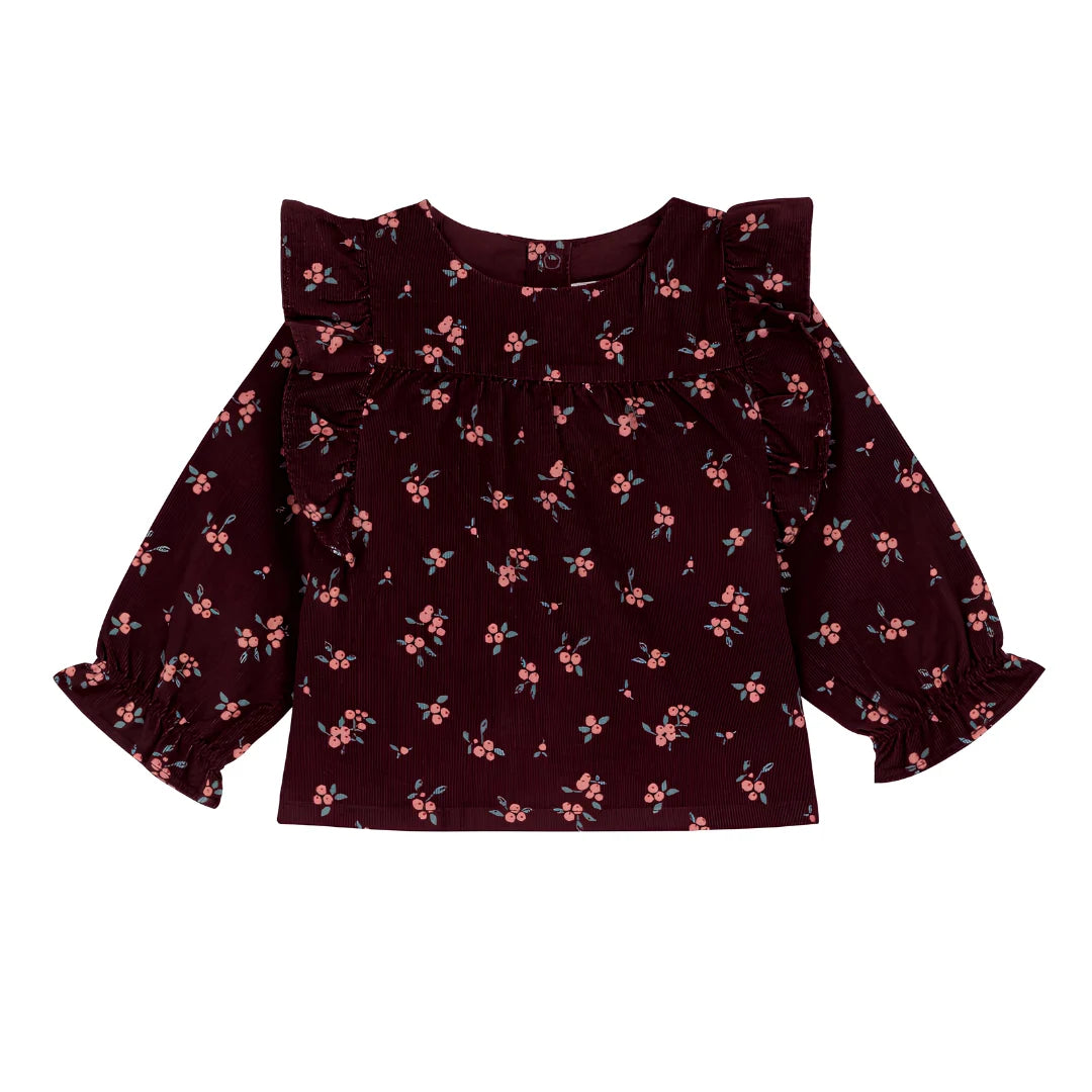 A breathtaking Petit Bateau long-sleeve baby blouse featuring an immaculate burgundy multi floral print on premium plush corduroy.