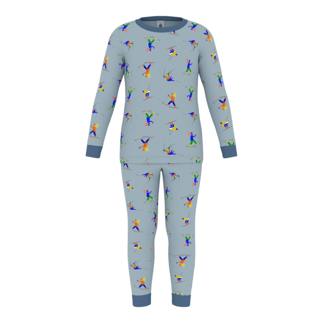 A breathtaking Petit Bateau two-piece pajama set featuring an immaculate blue ski print on a long-sleeve top and matching pants.