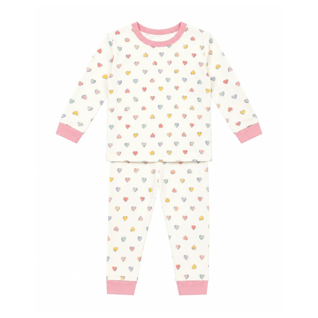 A front view of the Petit Bateau girls' heart-printed long-sleeve top and pants lounge set.