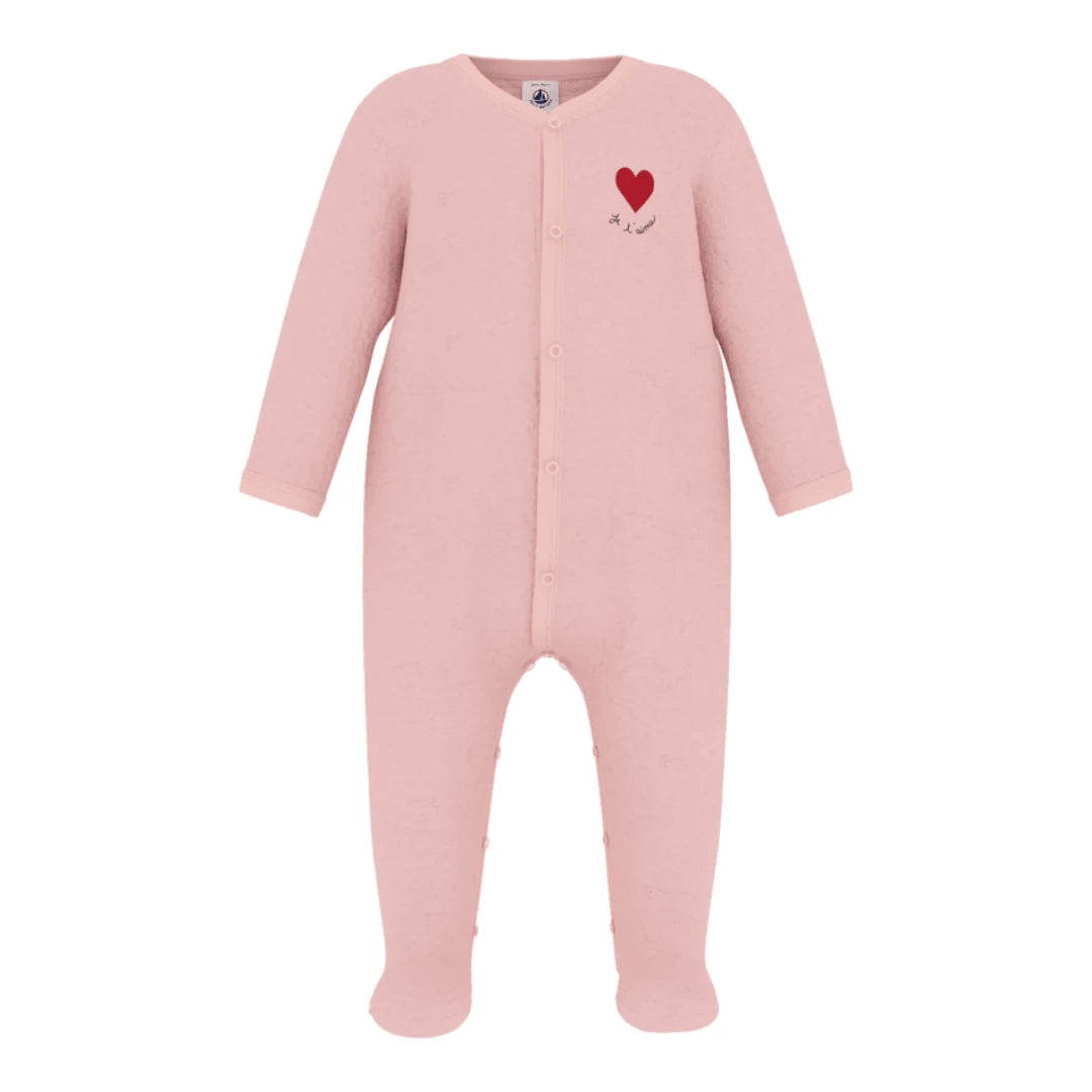 A breathtaking Petit Bateau Velour Footie featuring an immaculate pink palette, delicate heart detailing, and seamless front snap closures.