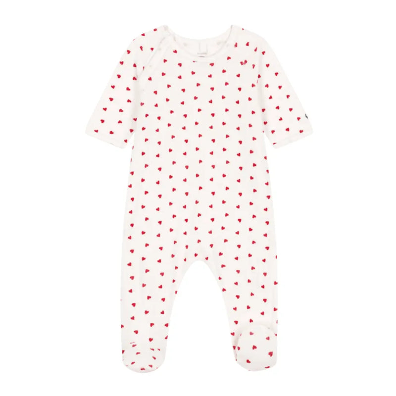 A breathtaking Petit Bateau Velour Footie featuring a pristine white palette, a delicate red heart print, and seamless side snap closures.