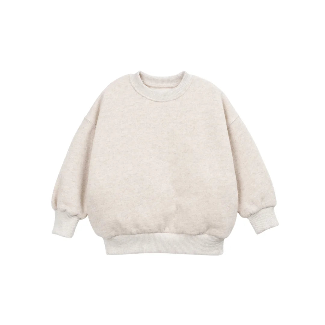 A front view of the Play Up fleece sweater in beige.