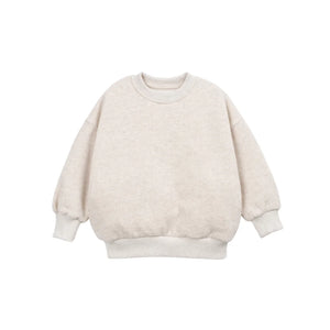 A front view of the Play Up fleece sweater in beige.