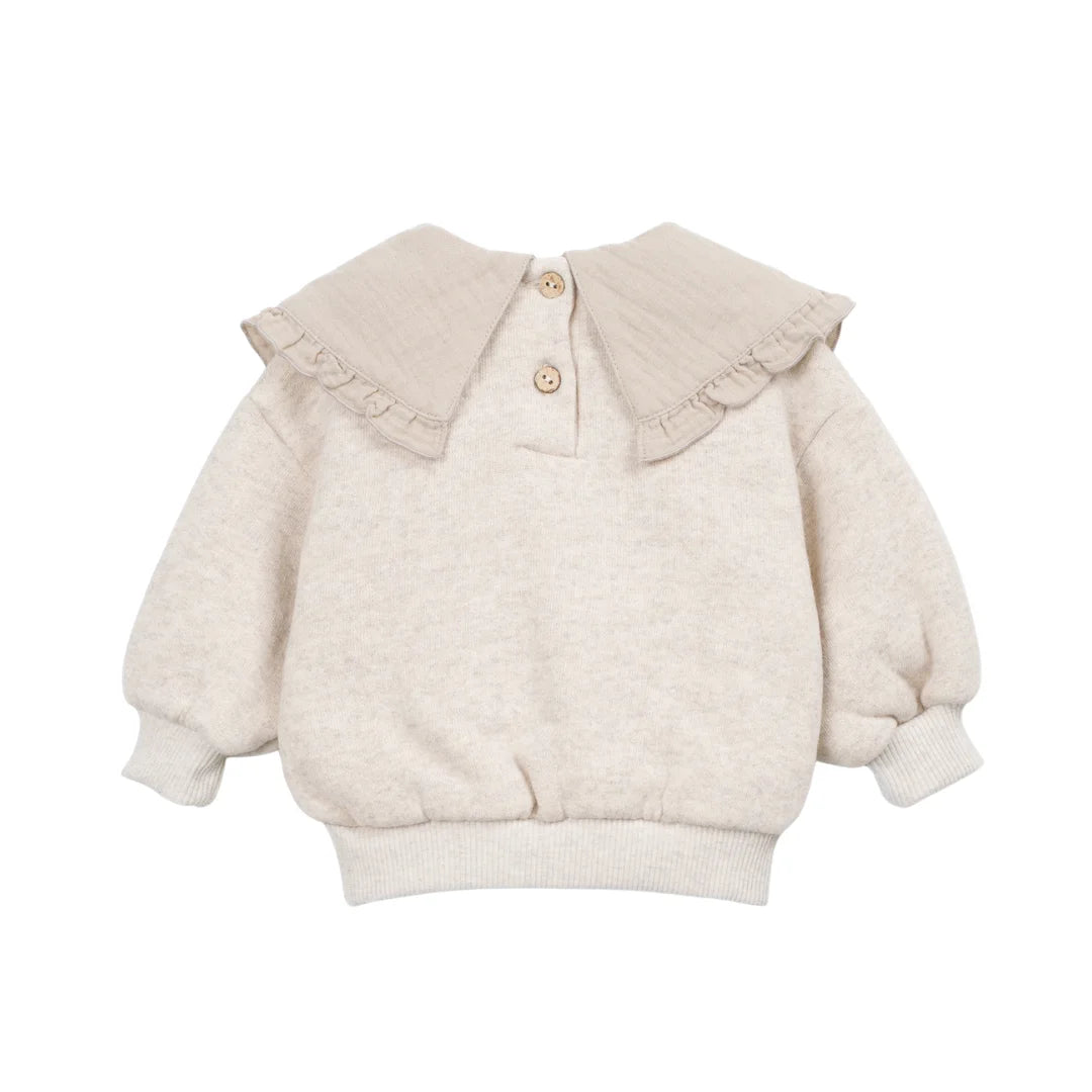 The clean back view highlighting the comfortable infant sweater silhouette.