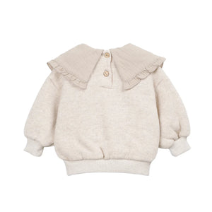 The clean back view highlighting the comfortable infant sweater silhouette.
