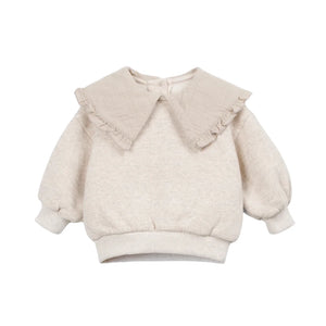 A front view of the Play Up knit sweater with contrast collar in beige.