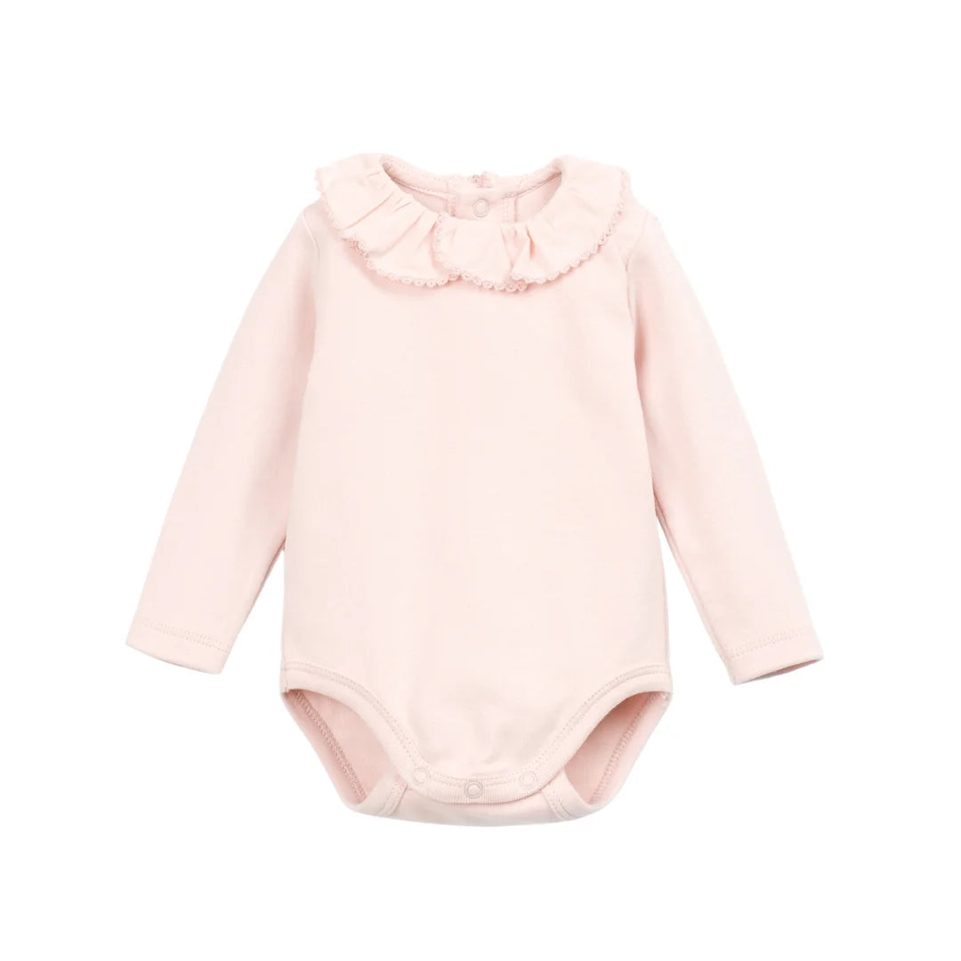 A front view of the Play Up rib bodysuit in pink.