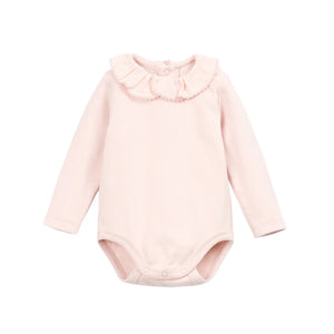 A front view of the Play Up rib bodysuit in pink.