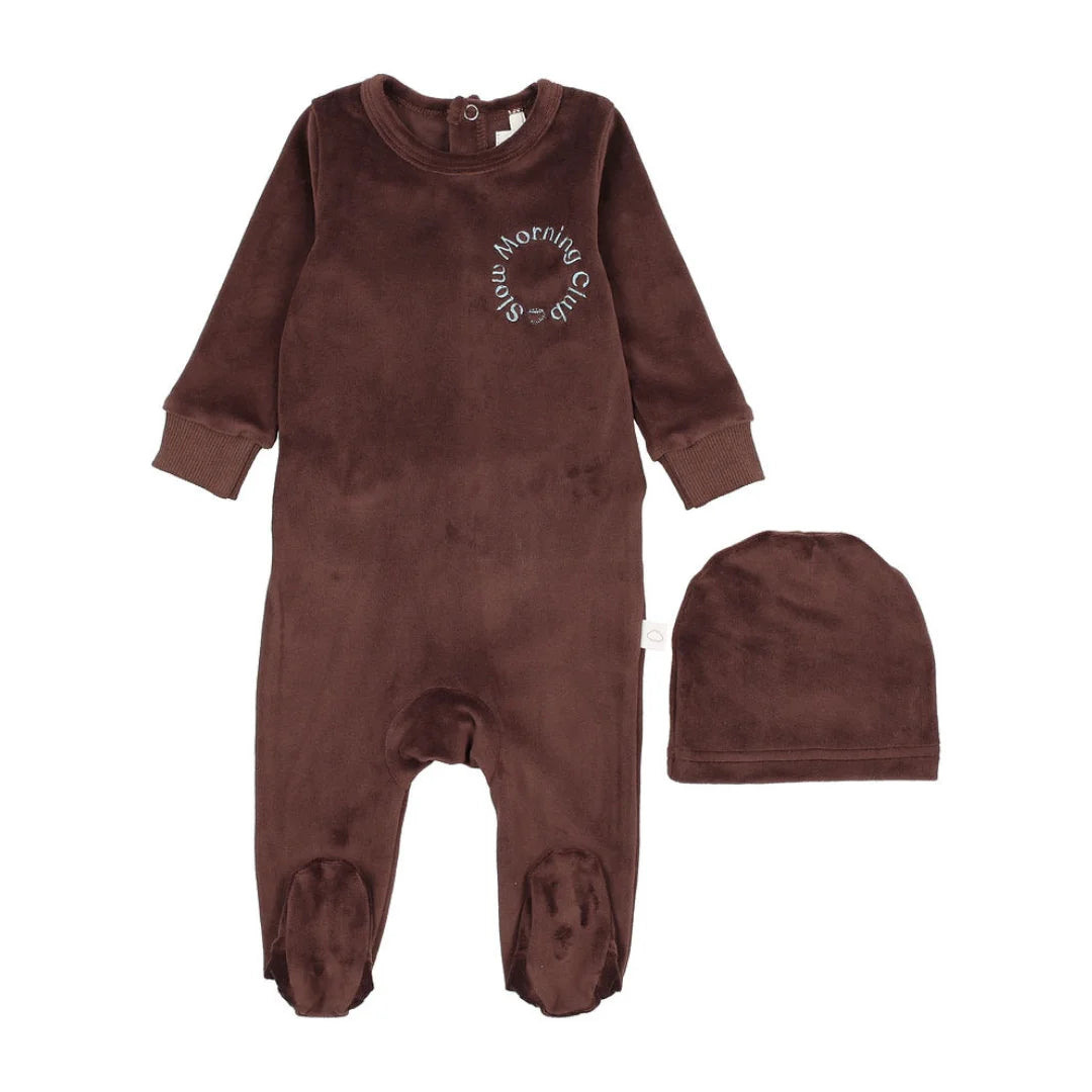 A front view of the Pouf brown velour baby footie with signature logo embroidery.