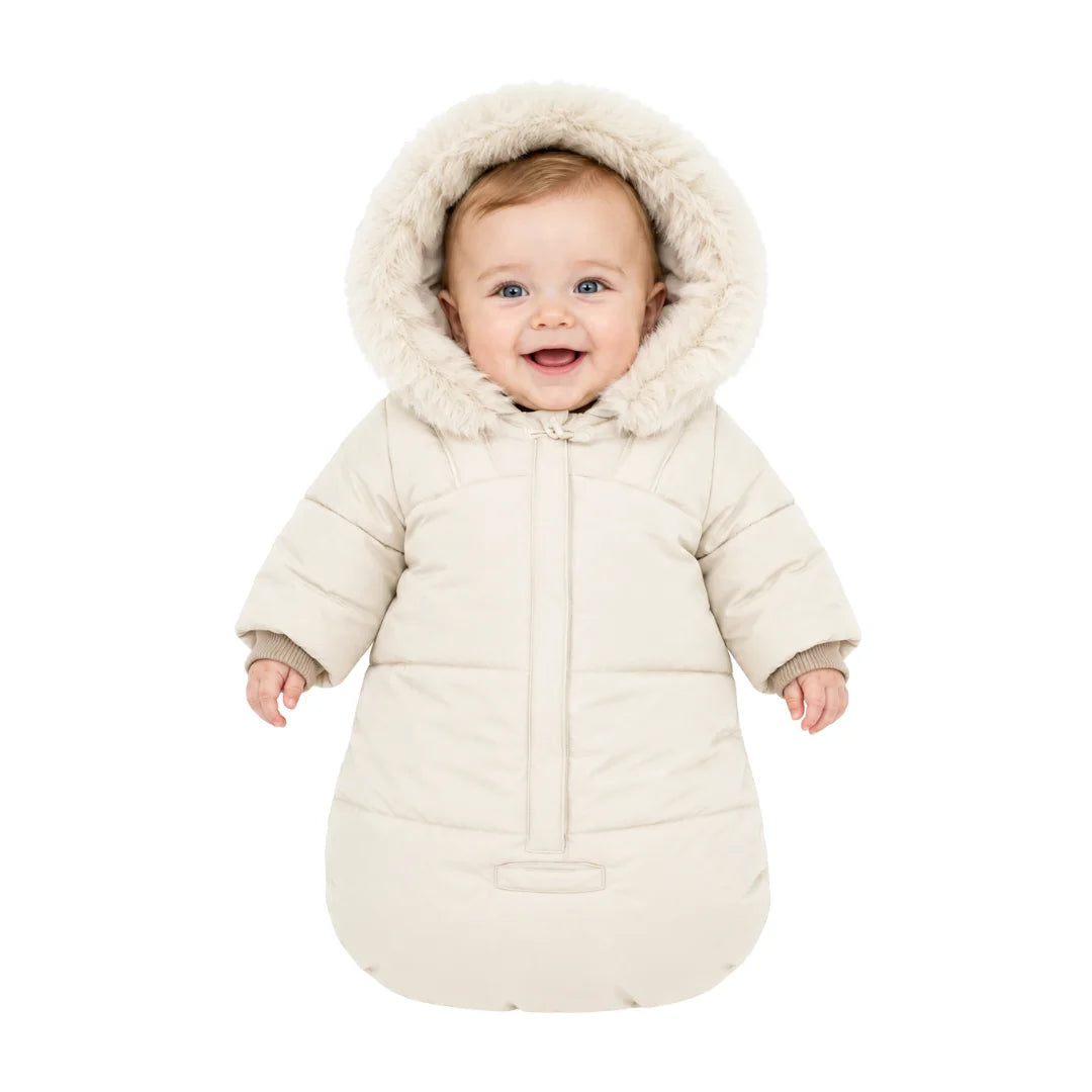 An infant resting comfortably in the Pramie beige lightweight snow suit