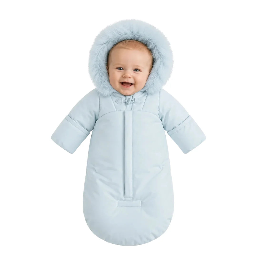 An infant resting comfortably in the Pramie blue snow suit