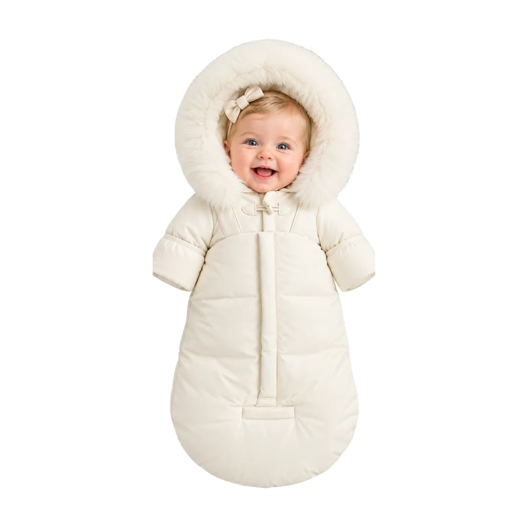 An infant resting comfortably in the Pramie ivory snow suit