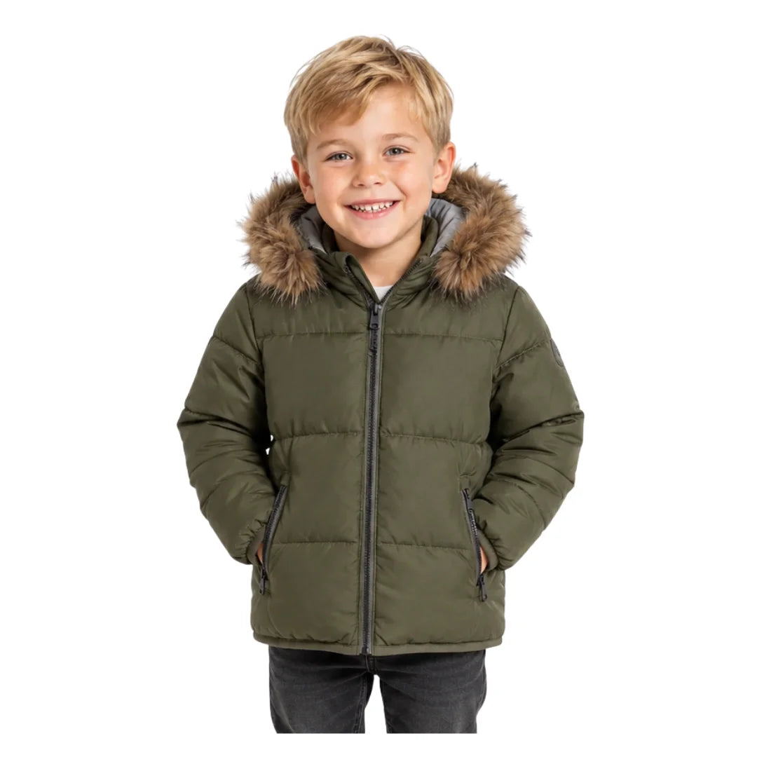 A child styled in the Pramie green contrast coat during an outdoor autumn outing.
