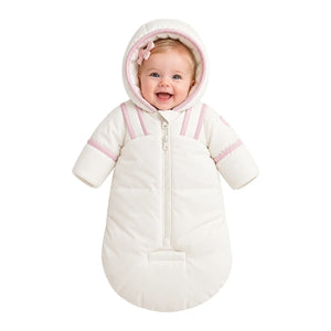 An infant resting comfortably in the Pramie mauve snow suit
