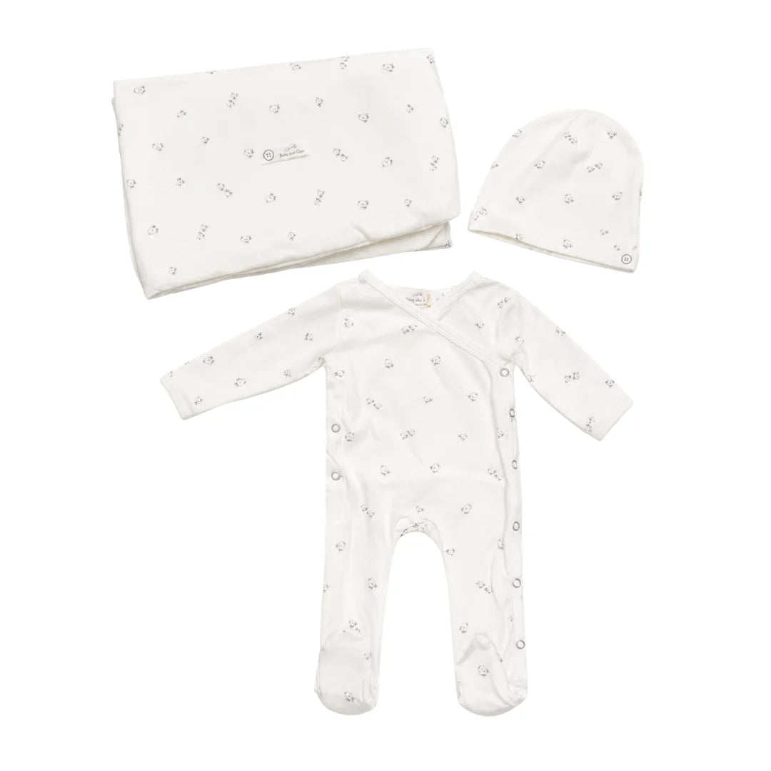 A front view of the Latte bird print footie and matching hat set.