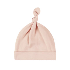 A front view of the Quincy Mae dusty rose bamboo knotted newborn baby hat.