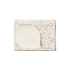 A flat lay view of the Quincy Mae bloom floral bamboo baby swaddle blanket.