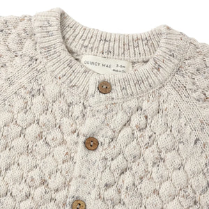 A high-resolution close-up of the bubble knit texture and multi-colored confetti flecks.