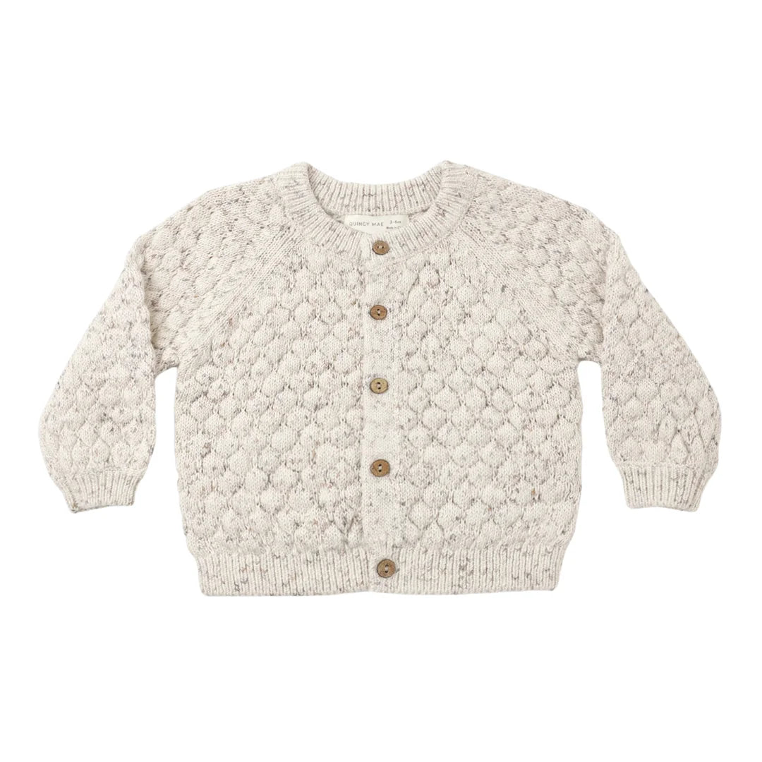 A front view of the Quincy Mae natural confetti bubble knit cardigan with wooden buttons.