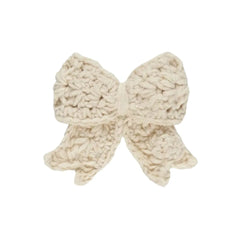 A flat-lay view of the Quincy Mae crochet hair bow in natural.