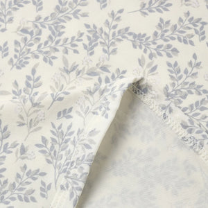 A high-resolution close-up of the silky bamboo textile texture and floral print.