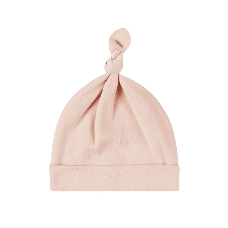 A front view of the Quincy Mae dusty rose organic cotton knotted newborn baby hat.