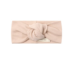 A front view of the Quincy Mae dusty rose organic cotton knotted baby headband.
