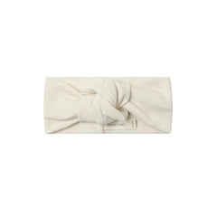 A front view of the Quincy Mae natural organic cotton knotted baby headband.