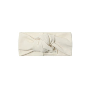 A front view of the Quincy Mae natural organic cotton knotted baby headband.