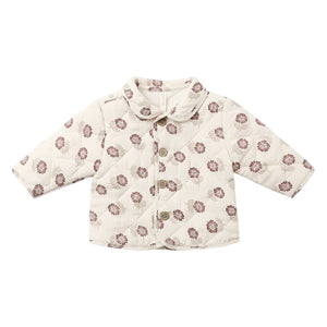 A front view of the Quincy Mae fall floral quilted organic cotton jacket with snap closures.