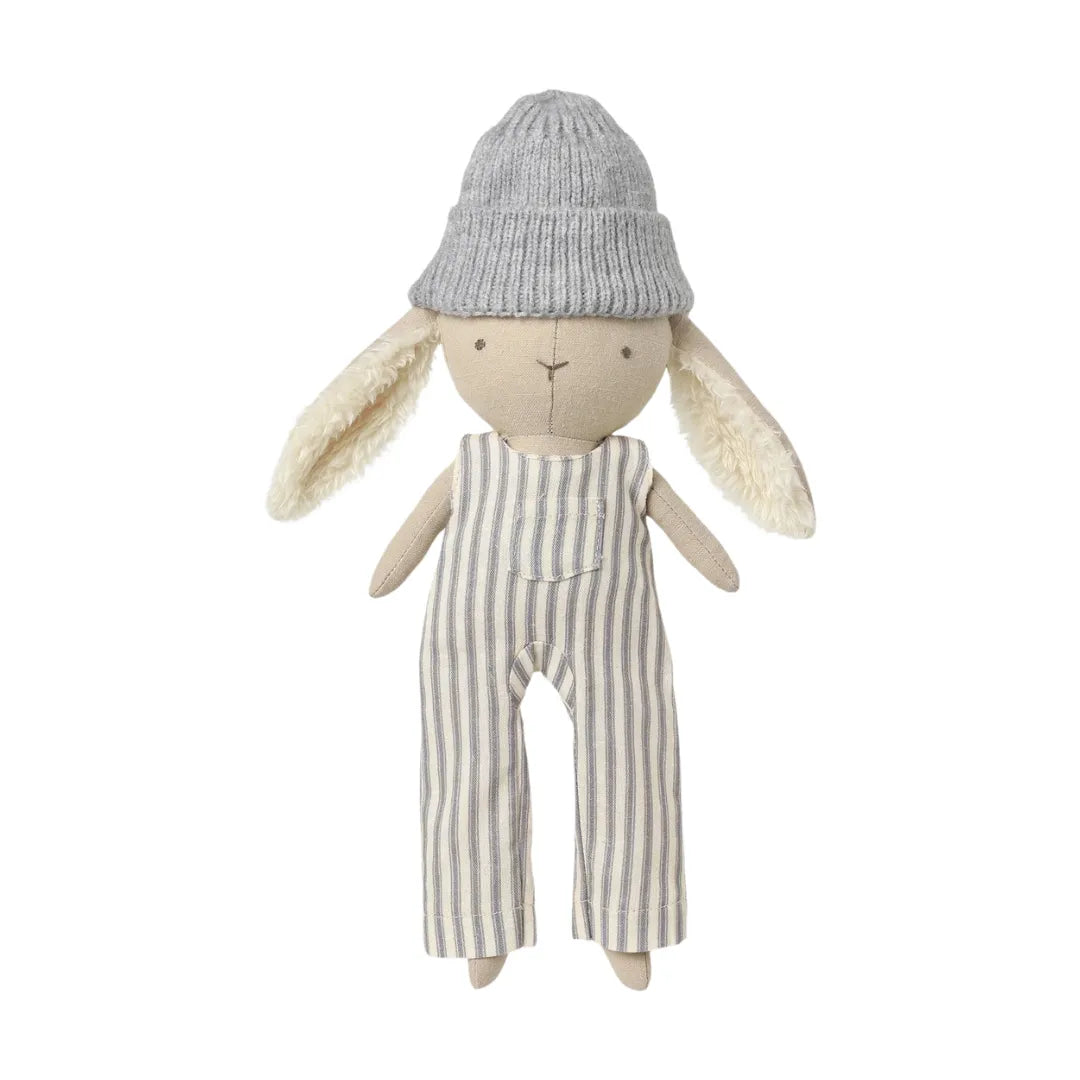 A flat-lay view of the Quincy Mae Ryder the rabbit organic plush toy.