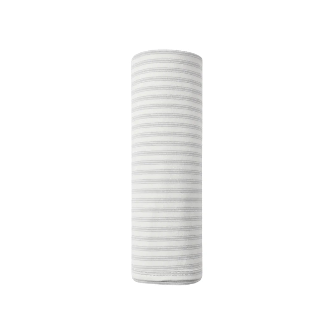 A flat lay view of the Quincy Mae cloud stripe organic cotton baby swaddle blanket.