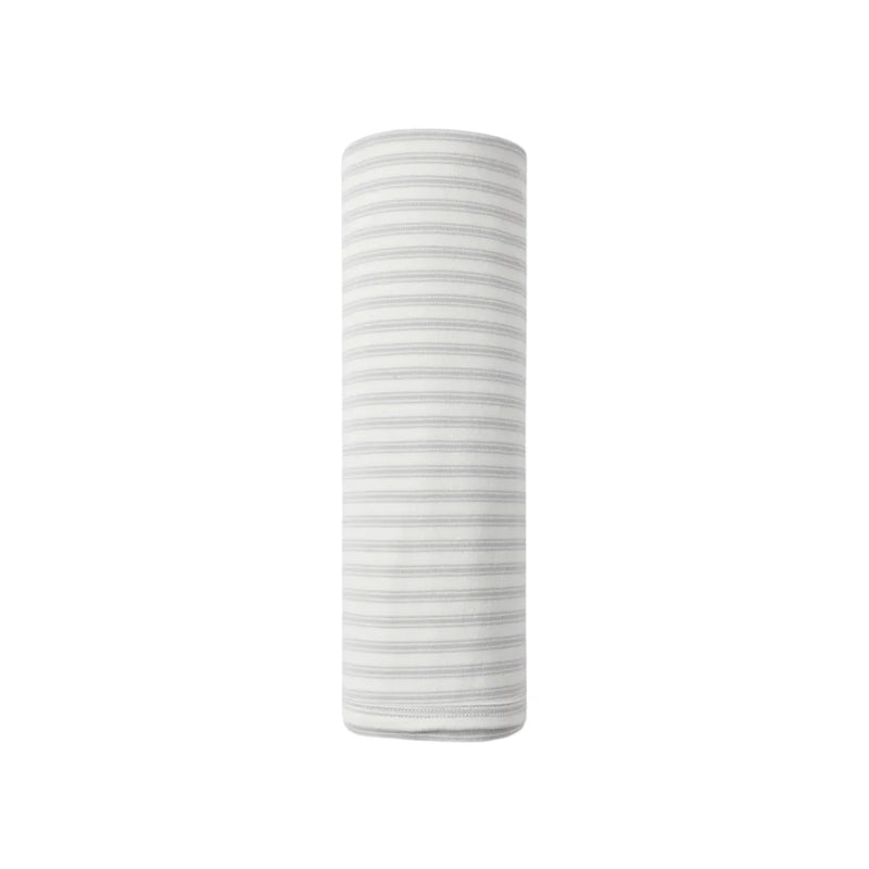 A flat lay view of the Quincy Mae cloud stripe organic cotton baby swaddle blanket.