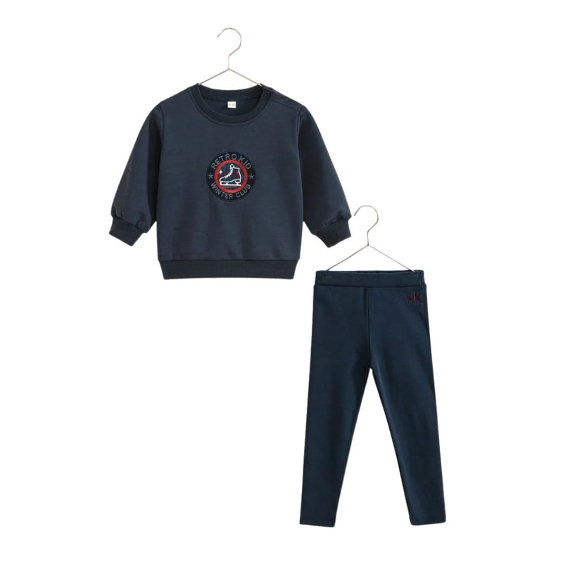 A beautifully structured RetroKid Arden two-piece baby boy set in a versatile indigo blue scuba fabric.