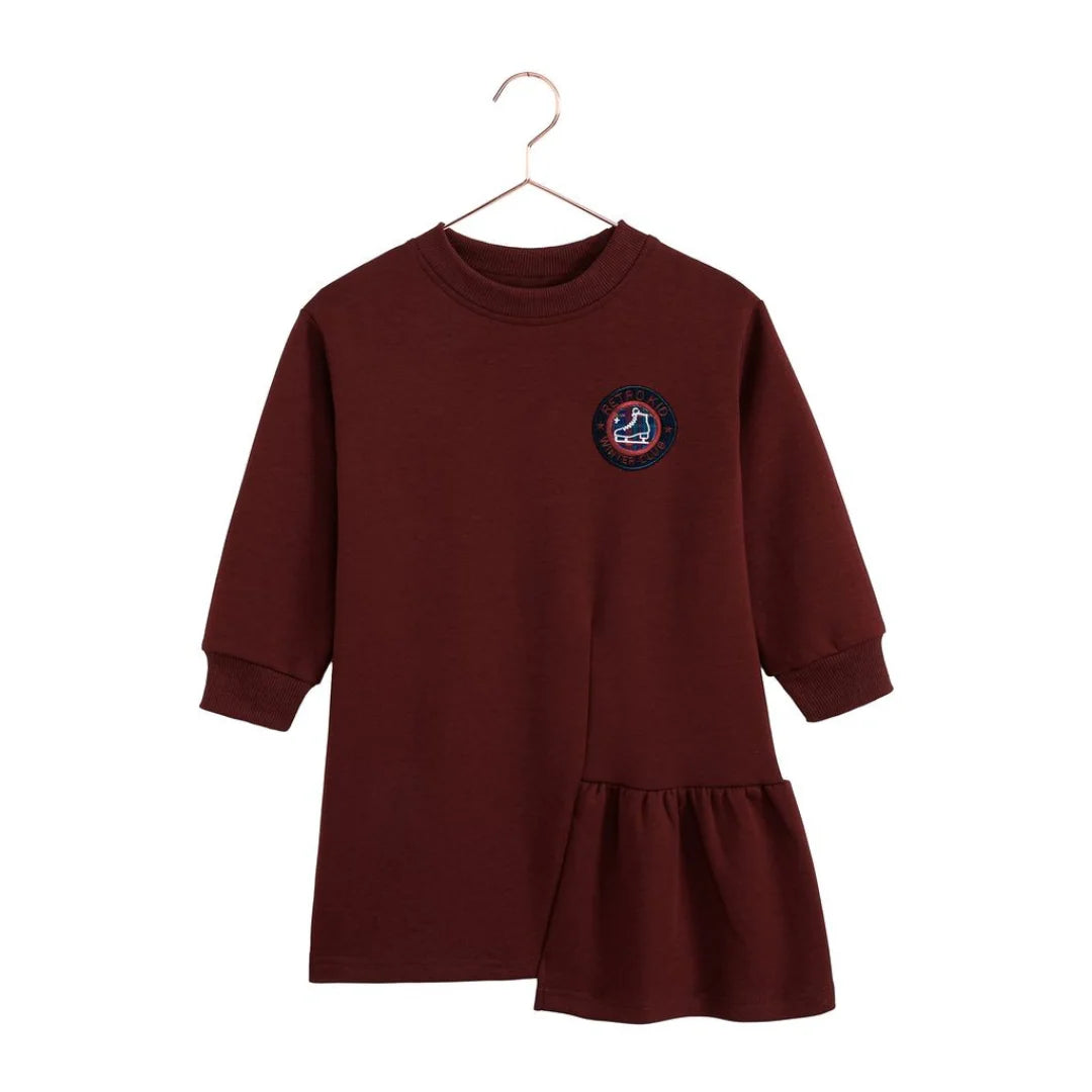 A beautifully styled RetroKid Arden dress in cranberry red featuring delicate side ruffles for babies and toddlers front