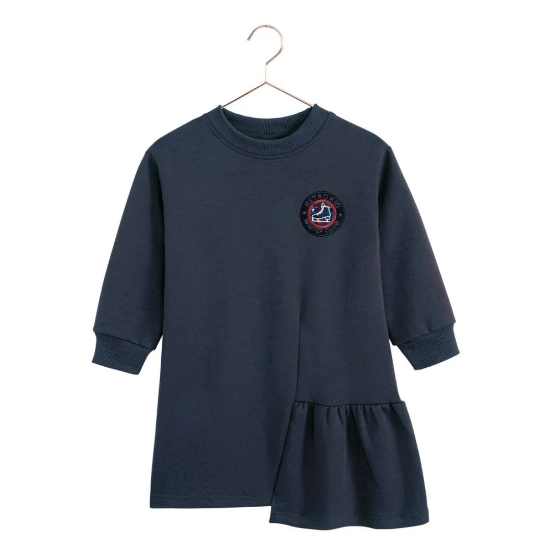 The front of the indigo blue Arden ruffle dress for girls by RetroKid, displaying its clean and simple rear profile.