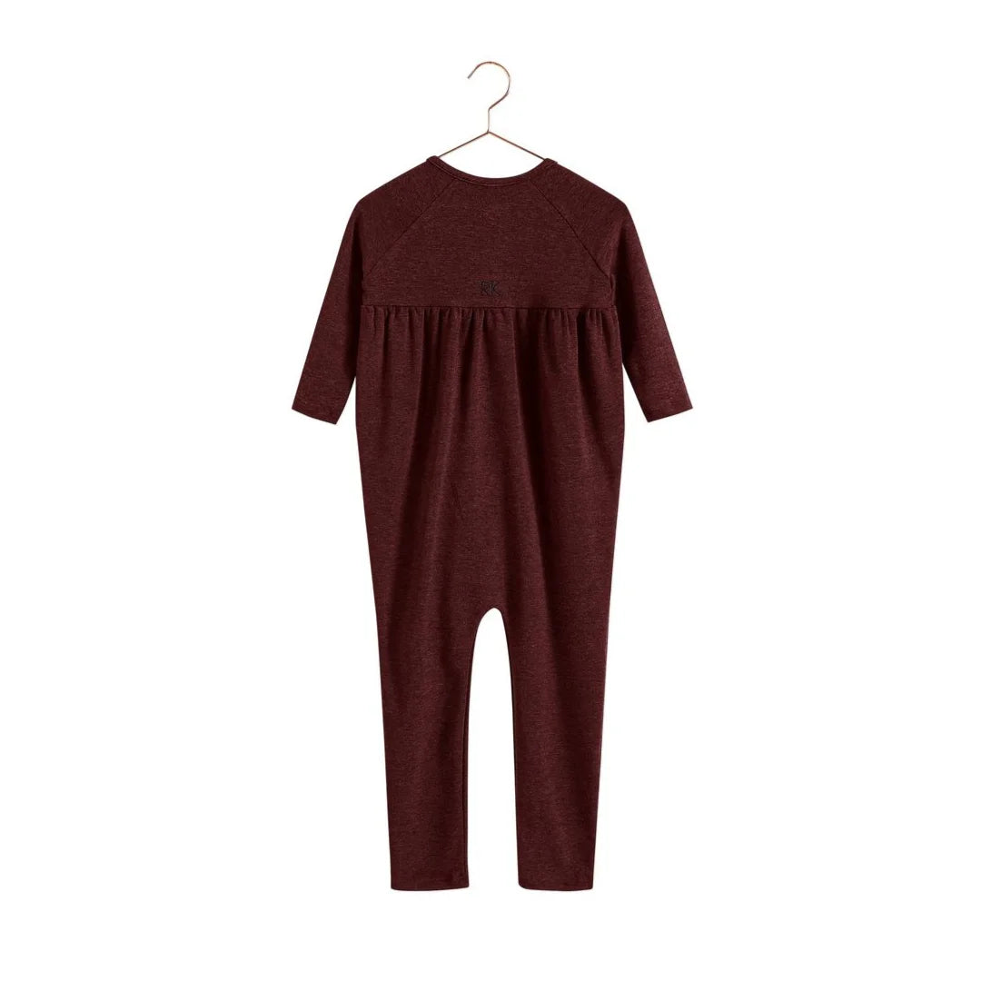 The back of the burgundy RetroKid Isla infant romper, showing its simple and clean one-piece design.