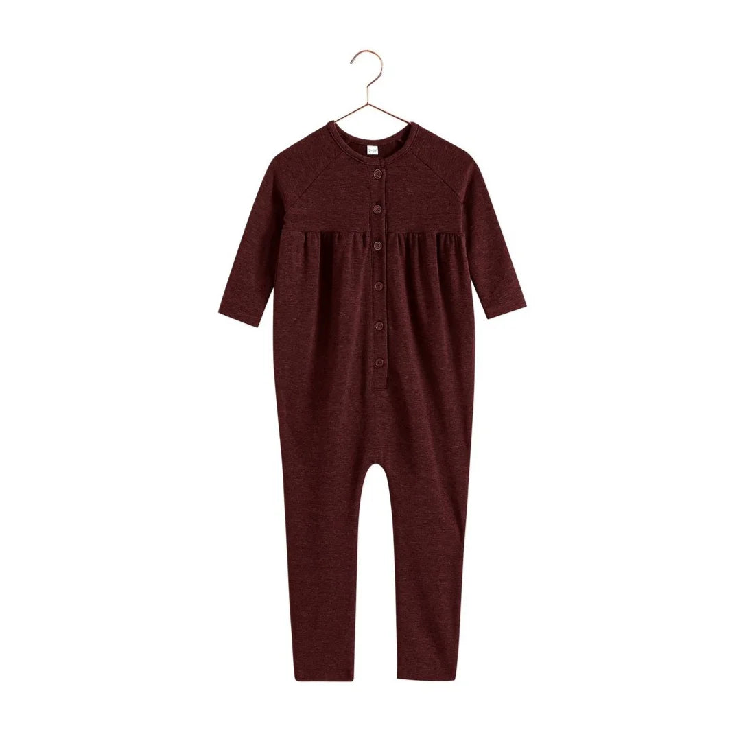 A front view of the RetroKid Isla baby romper in a deep burgundy color.