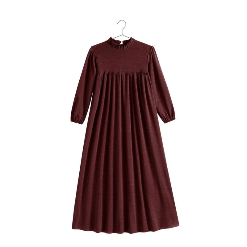 A profile view of the RetroKid girls sweater dress in burgundy, highlighting the relaxed, comfortable drape.