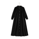A profile view of the RetroKid girls formal dress in black velvet, showing its graceful length.