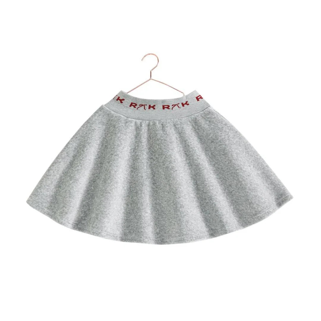 The back view of the gray and red RetroKid girls scuba skirt, showing its smooth, flared shape.