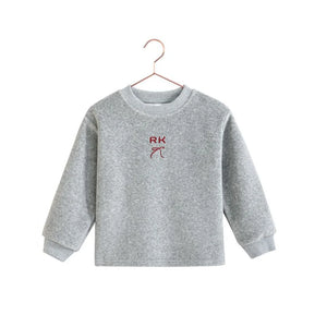 RetroKid featuring sporty red accents and a structured scuba fabric.