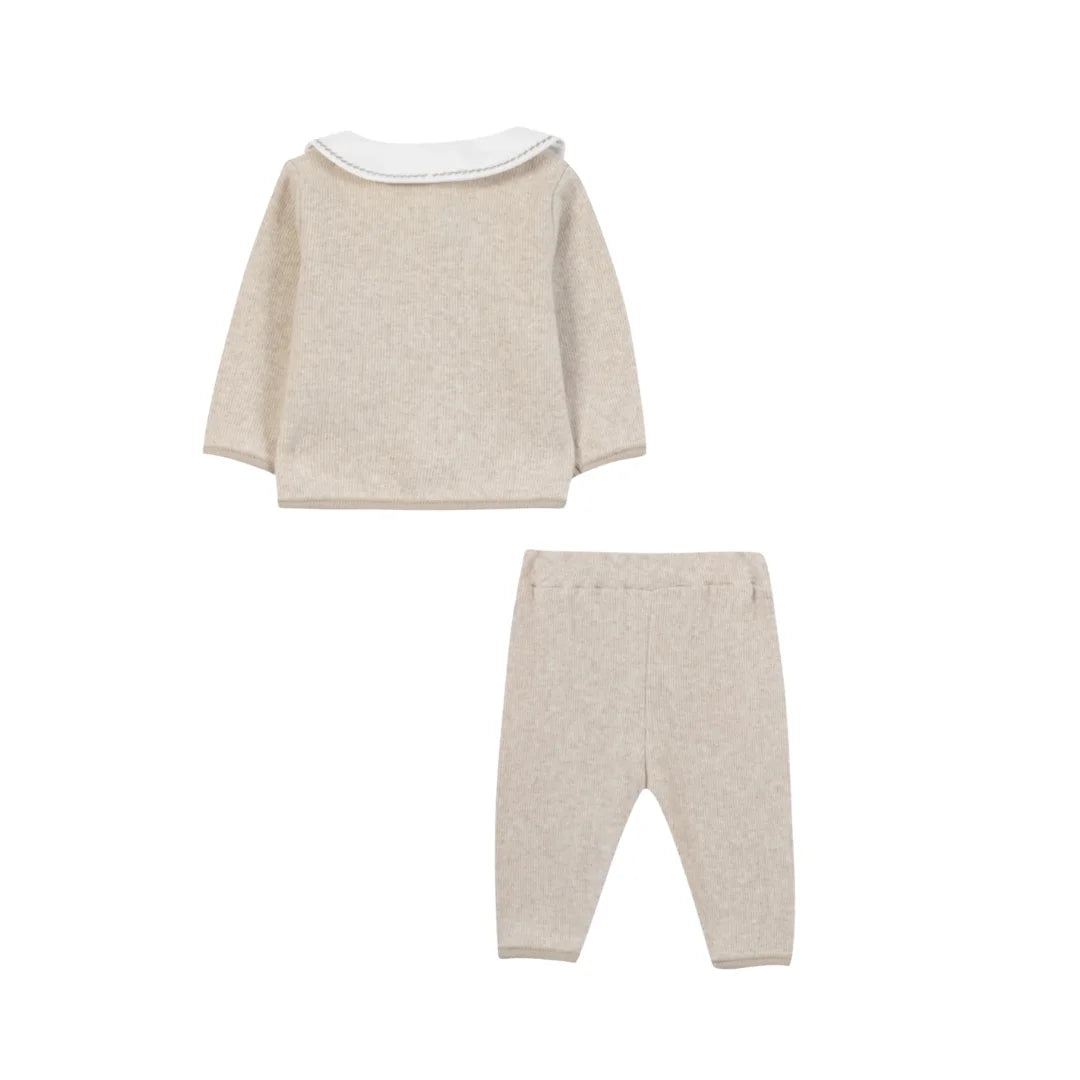 The clean back view of the luxury baby layette set.