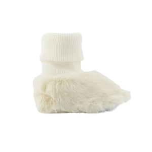 A high-resolution close-up of the plush imitation fur lining and organic cotton texture.