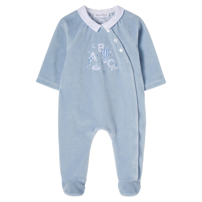 Blue baby onesie with white collar and ABC design on a white background
