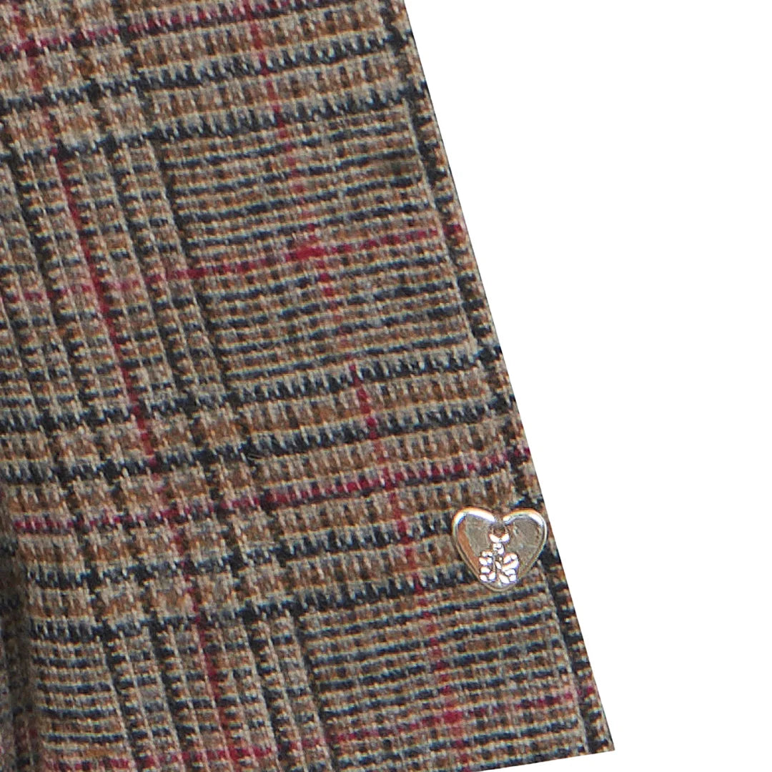 A high-resolution close-up of the velvet fabric texture, star details, and puffed sleeves.