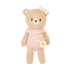 A flat-lay view of the Tuntun baby bear with purse in pink 8 inches.