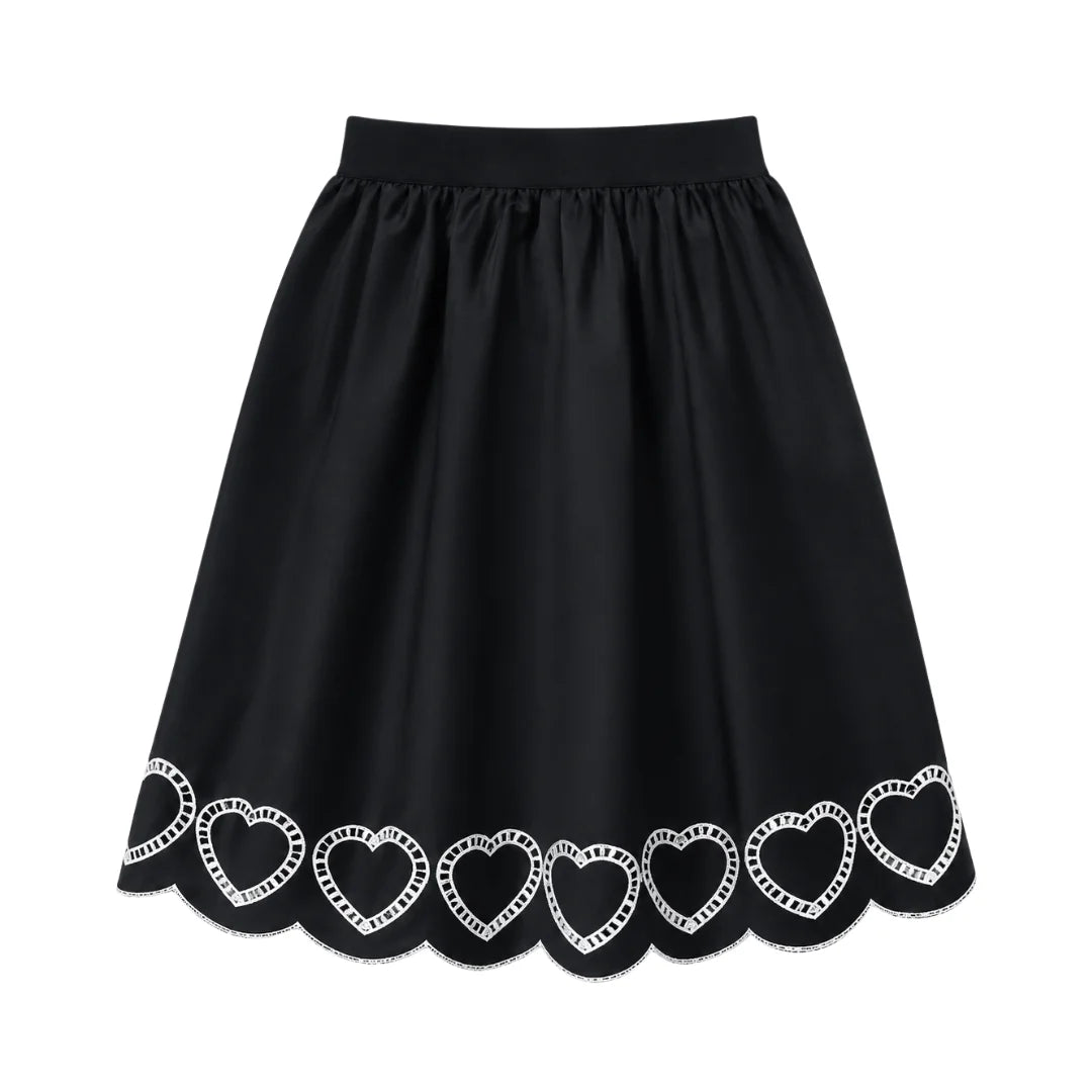 A front view of the We the Kids black scalloped heart children's skirt.